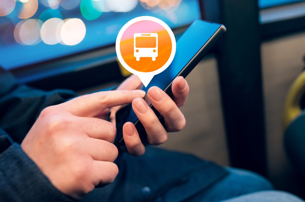 Woman using mobile phone app to purchase electronic ticket for bus public transportation, close up of female hands with smartphone, selective focus